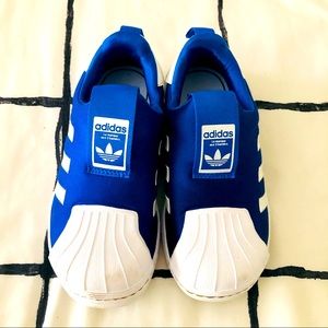 Shiny blue Adidas slip on sneakers